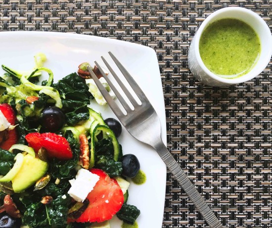 Mixed Berry and Kale Summer Salad served with a low carb mint vinaigrette.